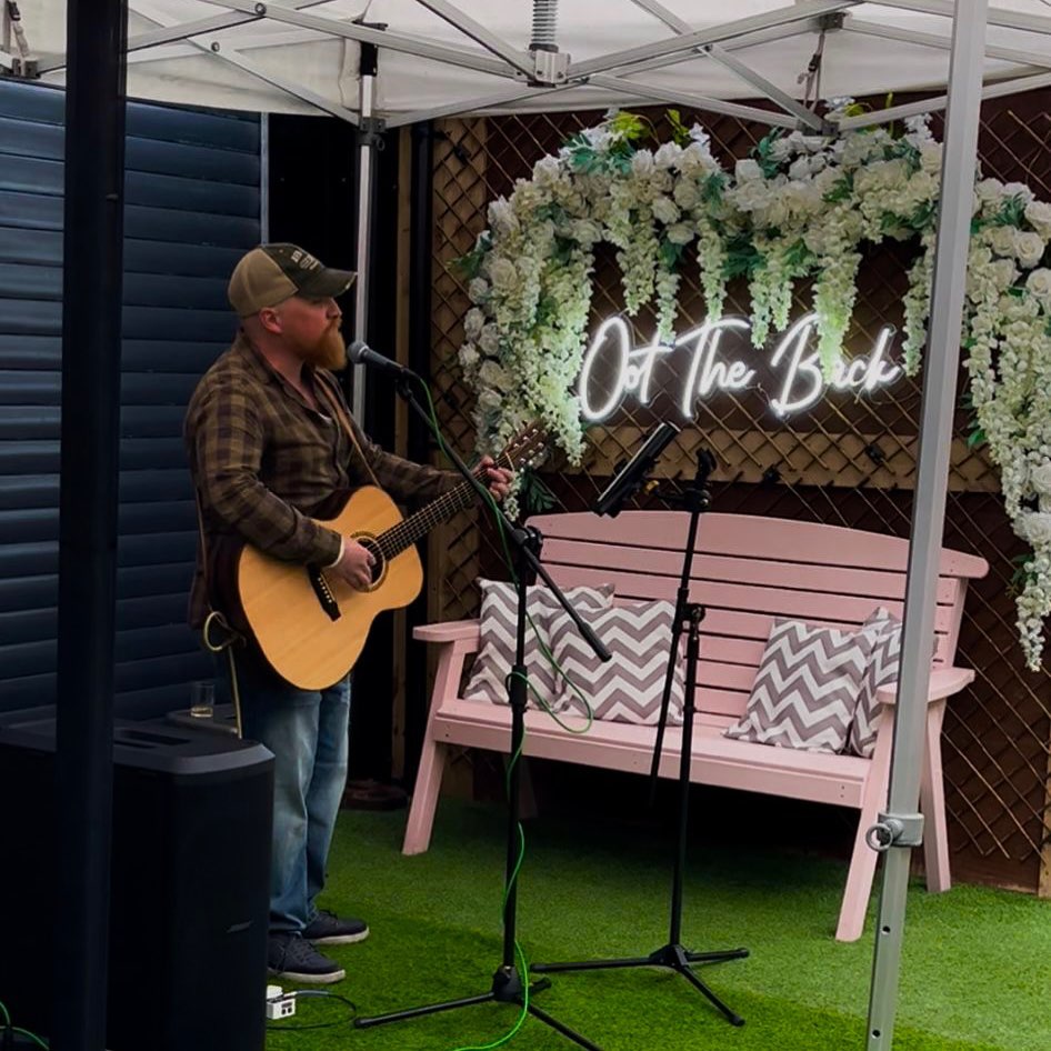 Musician playing at Oot the Back