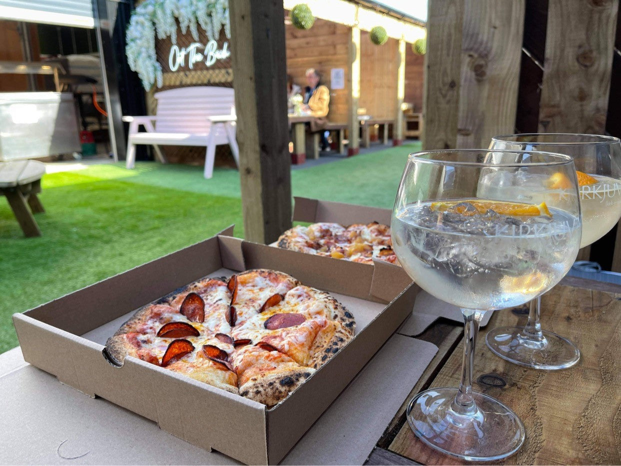 Pizza and drinks at Oot the Back, Orkney Distilling's outdoor garden bar